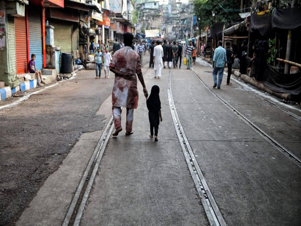 Father and daughter - both participants of the Muharram procession; Kolkata, India - Oct 2016