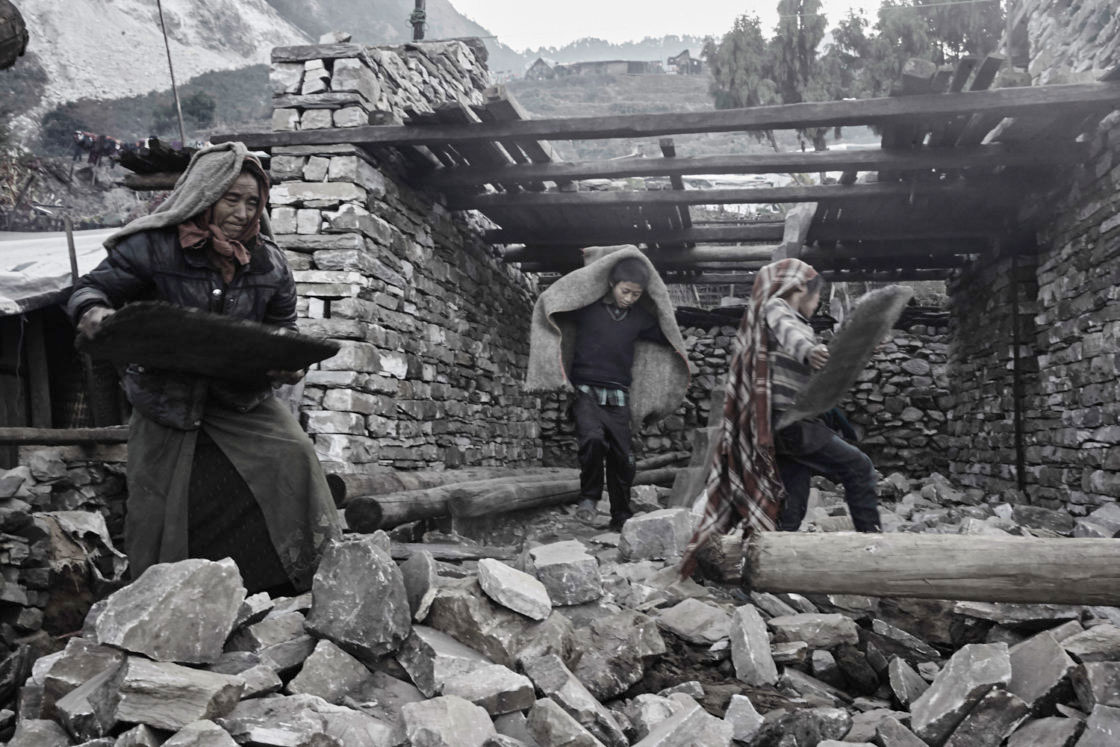 Villagers rebuilding their home in the remote village of Kerauja in Gorkha district.