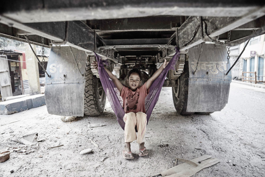 Earthquake survivor living in a truck together with her family.