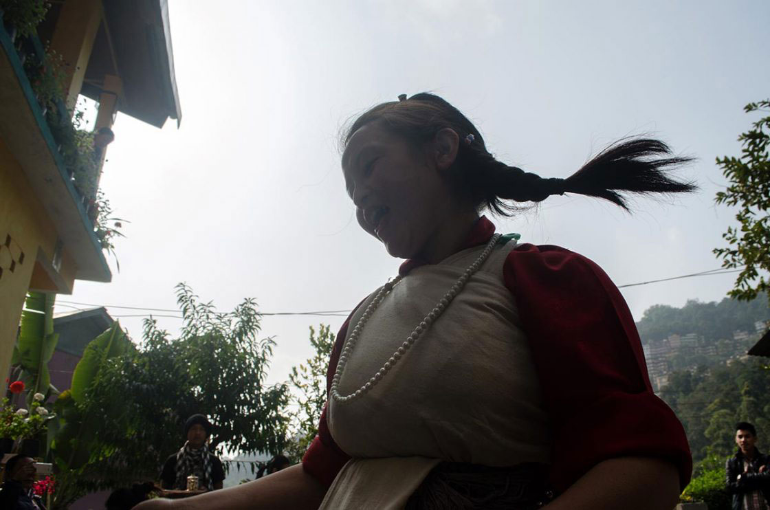 Sikkim, India- December 2015. A "Lepcha" performers dressed traditionally dancing with traditional song at Sehri Kopibari.