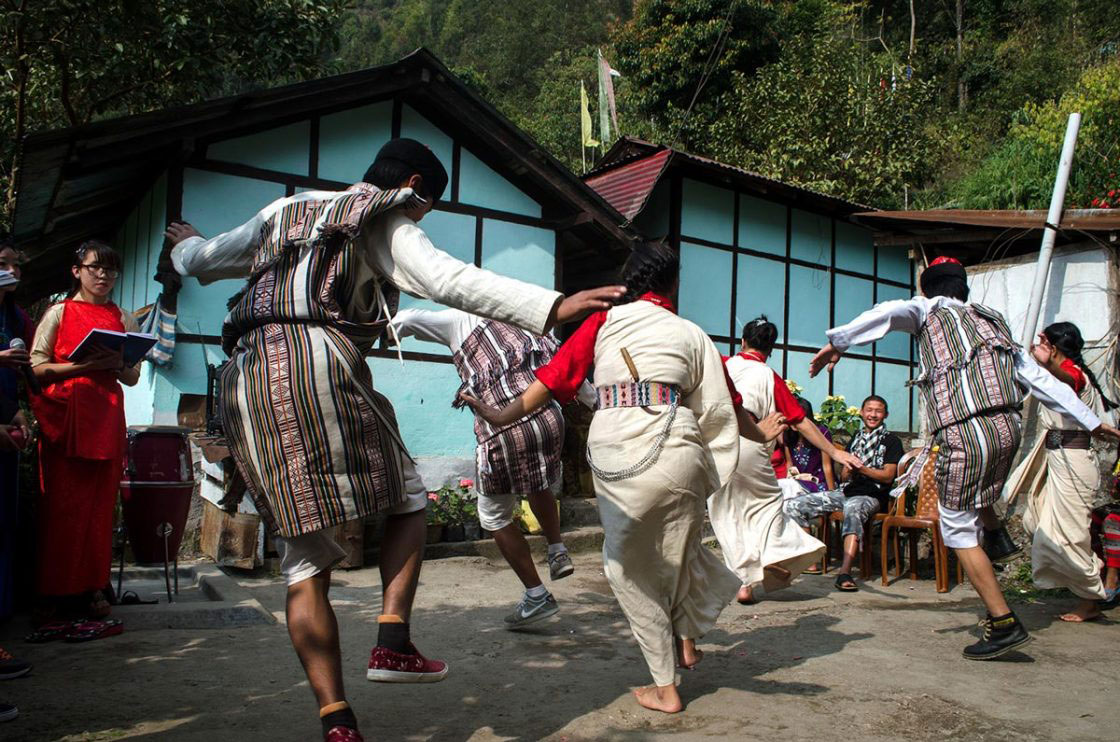 Sikkim, India- December 2015. Group of "Lepcha" performer dressed traditionally dancing with traditional song at Sehri Kopibari.